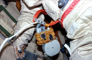 View of Mir space station airlock (Kvant-2) with a close up view of an Orlan suit.